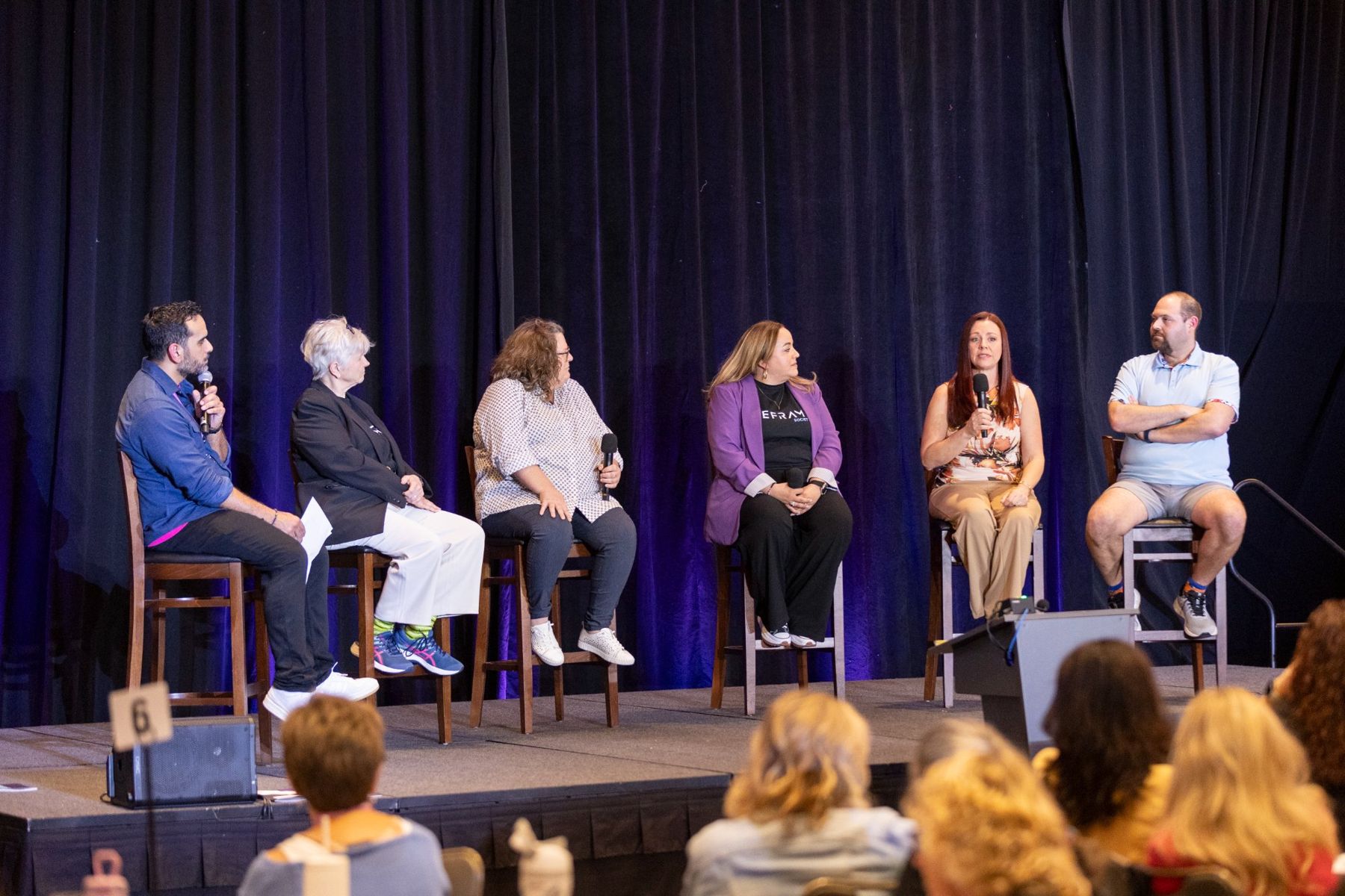 Amanda on a six-person conference panel